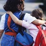 School Reopening - friends with backpacks going-to school